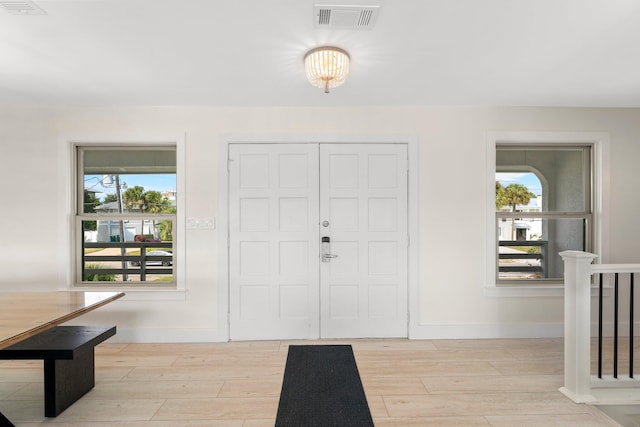 entrance foyer with light hardwood / wood-style flooring