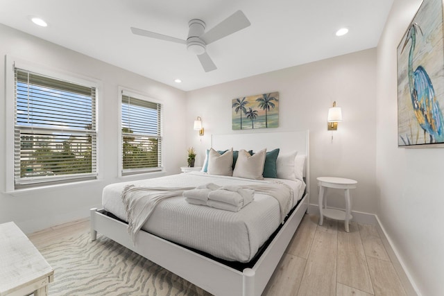 bedroom featuring ceiling fan and light hardwood / wood-style flooring