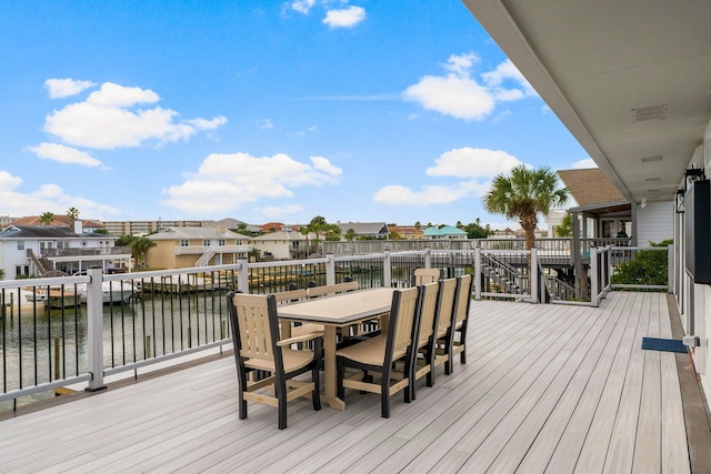 wooden deck featuring a water view