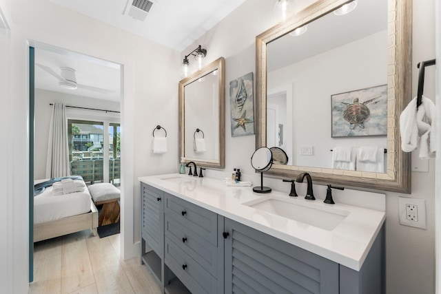 bathroom with vanity and hardwood / wood-style floors