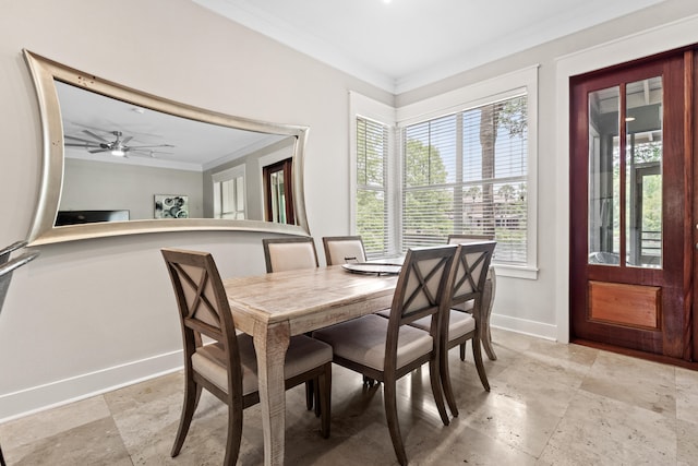 dining area featuring ceiling fan and ornamental molding