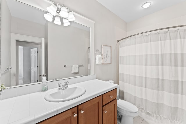 bathroom with a shower with curtain, tile patterned flooring, vanity, and toilet