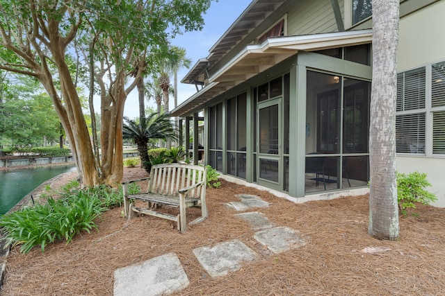 view of yard featuring a sunroom