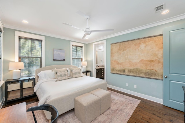 bedroom featuring connected bathroom, dark wood-type flooring, ornamental molding, and ceiling fan