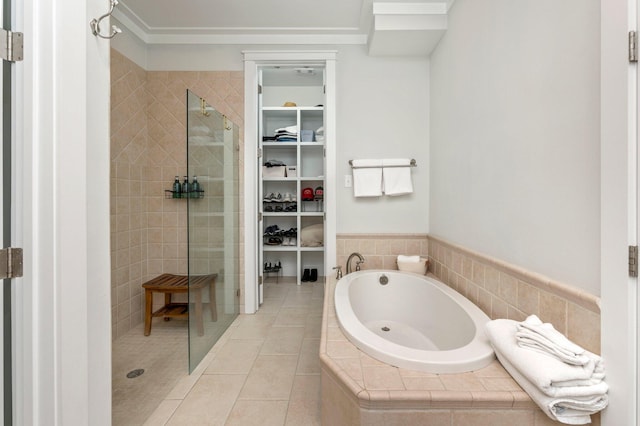 bathroom featuring separate shower and tub and tile patterned floors