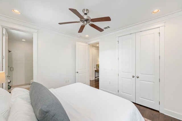 bedroom with dark hardwood / wood-style flooring, crown molding, a closet, and ceiling fan