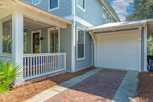 view of exterior entry with a garage