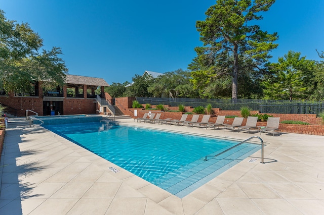 view of swimming pool with a patio area