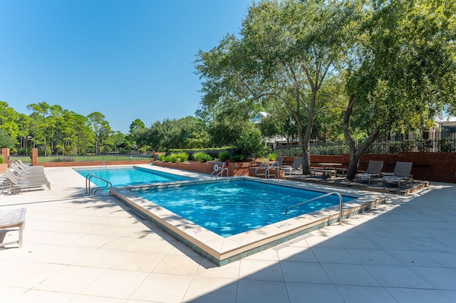 view of pool featuring a patio