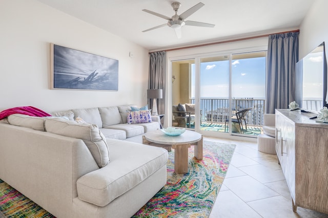 living room featuring ceiling fan and light tile patterned floors