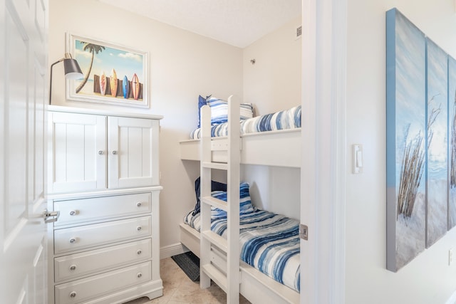 bedroom featuring light tile patterned floors