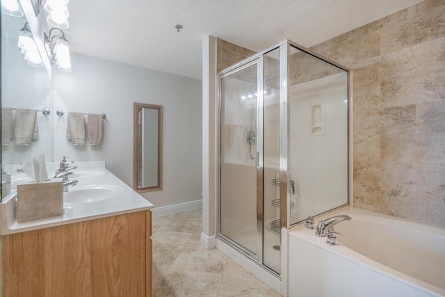 bathroom with plus walk in shower, tile patterned floors, vanity, and a textured ceiling