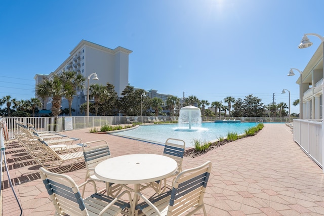 view of swimming pool featuring a patio and pool water feature