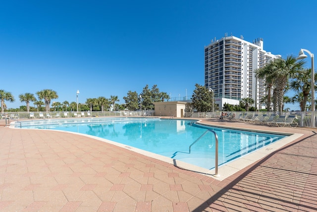 view of swimming pool featuring a patio