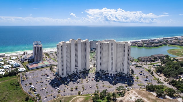 birds eye view of property featuring a water view and a view of the beach