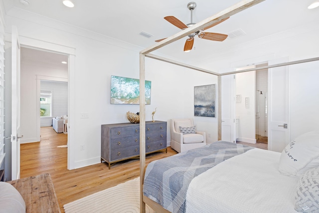 bedroom with ceiling fan and light hardwood / wood-style flooring