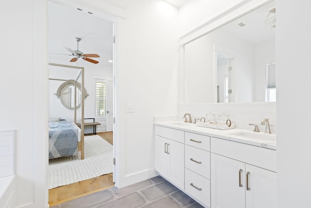 bathroom featuring ceiling fan, vanity, and hardwood / wood-style floors