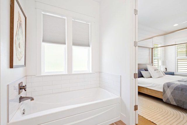 bathroom featuring separate shower and tub