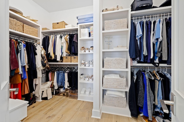 spacious closet featuring light hardwood / wood-style flooring