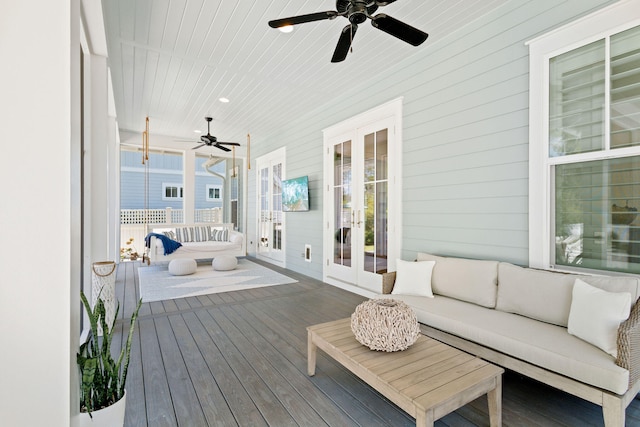 deck featuring ceiling fan, outdoor lounge area, and french doors