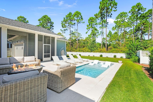 view of pool with an outdoor hangout area, a sunroom, a lawn, and a patio area