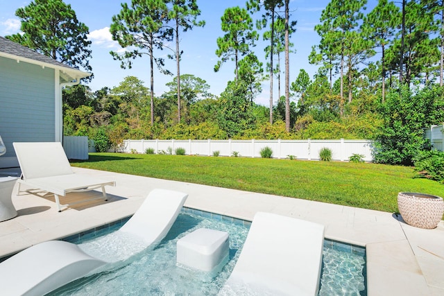 view of pool featuring a yard and a patio area