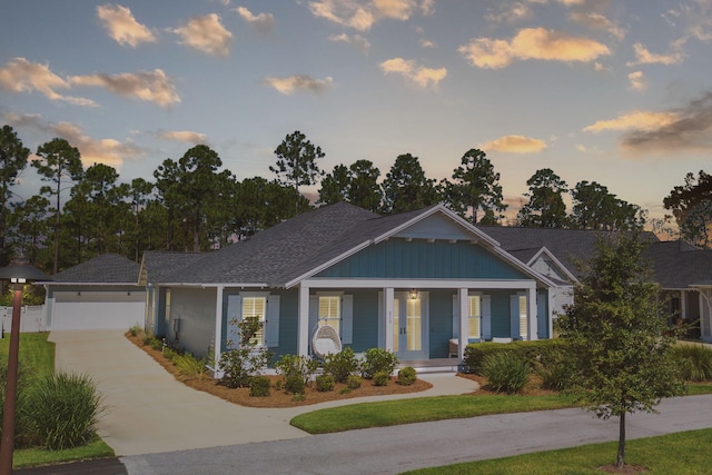 view of front of house featuring a garage and covered porch