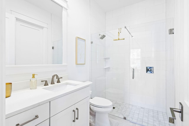 bathroom with toilet, tile patterned flooring, vanity, and a shower with shower door