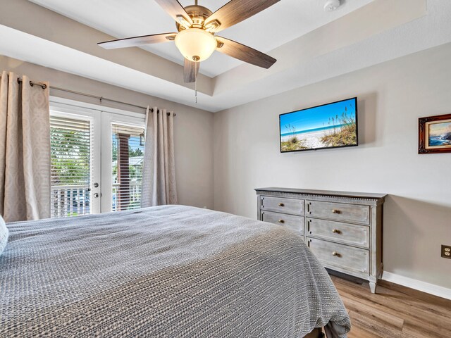 bedroom with french doors, ceiling fan, access to outside, and light wood-type flooring