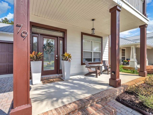 doorway to property with covered porch