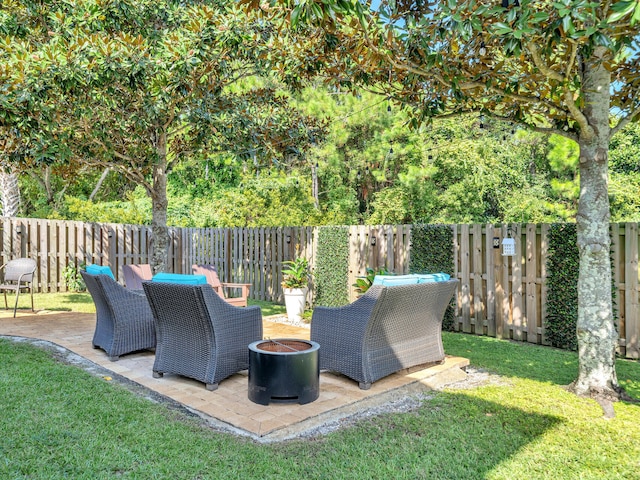 view of yard featuring a patio area and an outdoor fire pit