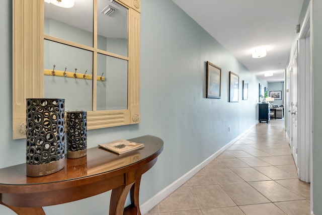 hallway with light tile patterned floors