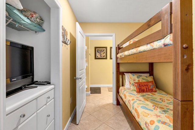 bedroom with light tile patterned floors