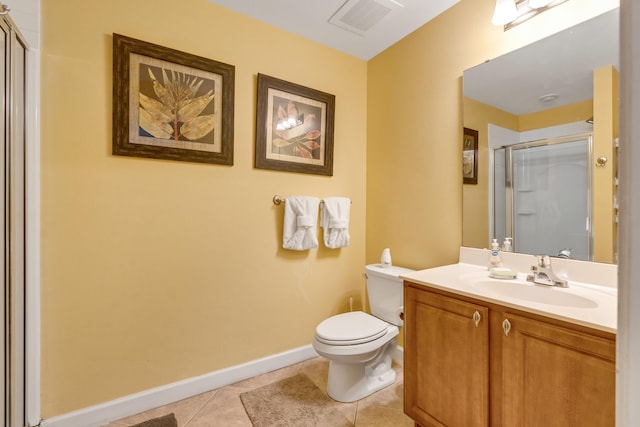 bathroom with walk in shower, vanity, toilet, and tile patterned floors