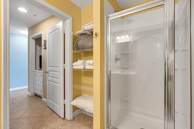 bathroom featuring tile patterned flooring and walk in shower