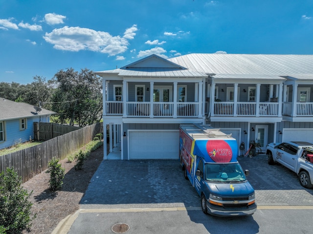 view of front of home with a garage and a porch