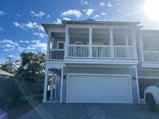 beach home with a balcony and a garage