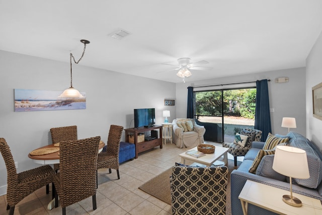 living room featuring ceiling fan and light tile patterned flooring