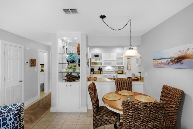 59 N Myrtle Dr Unit 207, Santa Rosa Beach, FL 32459 - dining room with light tile patterned flooring