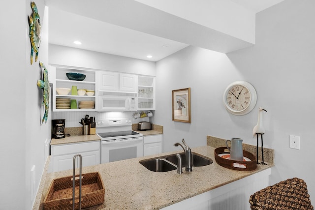 59 N Myrtle Dr Unit 207, Santa Rosa Beach, FL 32459 - kitchen featuring white appliances, a sink, light stone countertops, open shelves, and white cabinets