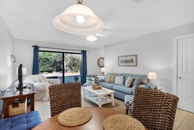 tiled living room featuring ceiling fan