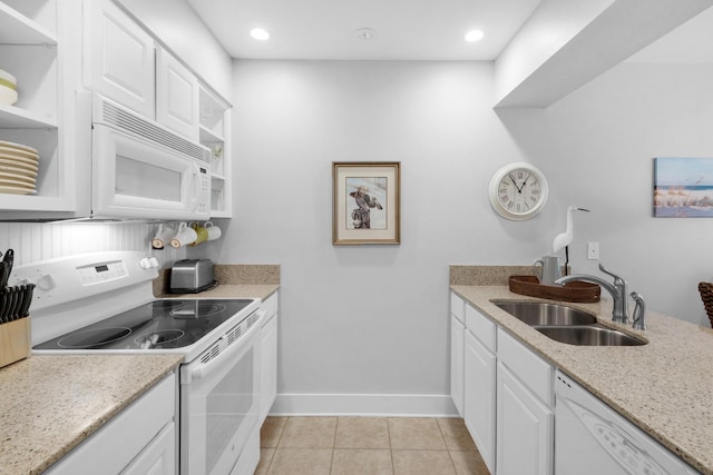 59 N Myrtle Dr Unit 207, Santa Rosa Beach, FL 32459 - kitchen featuring white appliances, a sink, white cabinets, baseboards, and light tile patterned floors