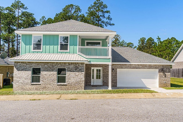 view of front of house with a balcony and a garage