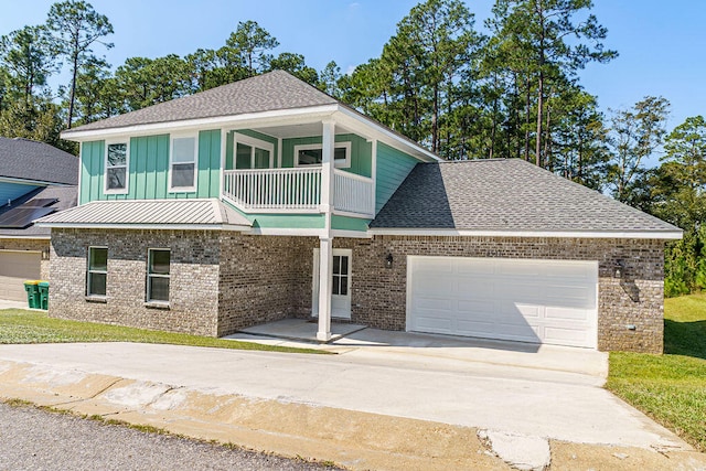 view of front facade featuring a balcony and a garage