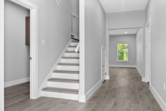 stairway featuring hardwood / wood-style flooring