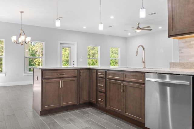 kitchen featuring pendant lighting, sink, a healthy amount of sunlight, and stainless steel dishwasher