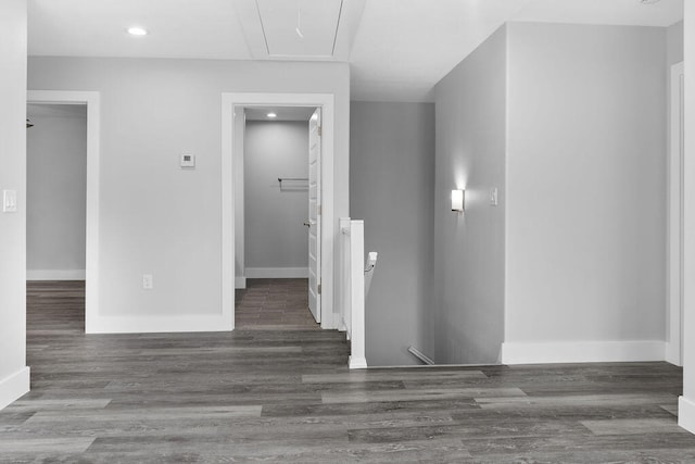 corridor with dark hardwood / wood-style flooring