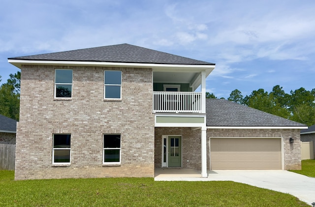 4540 Hermosa Rd, Crestview, FL 32539 - rear view of property featuring a balcony, a lawn, concrete driveway, and a shingled roof