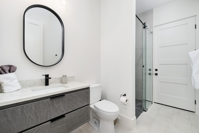 bathroom with vanity, a shower with shower door, toilet, and tile patterned flooring