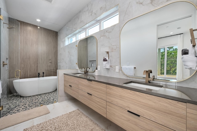 bathroom featuring vanity, shower with separate bathtub, tile walls, and tile patterned flooring